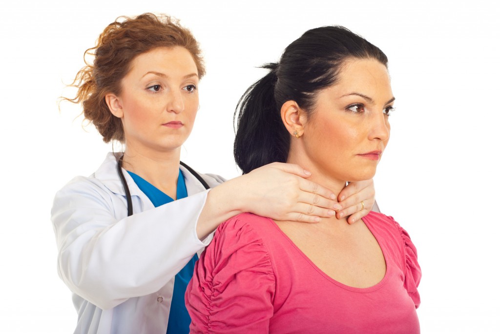 Endocrinologist examine thyroid woman